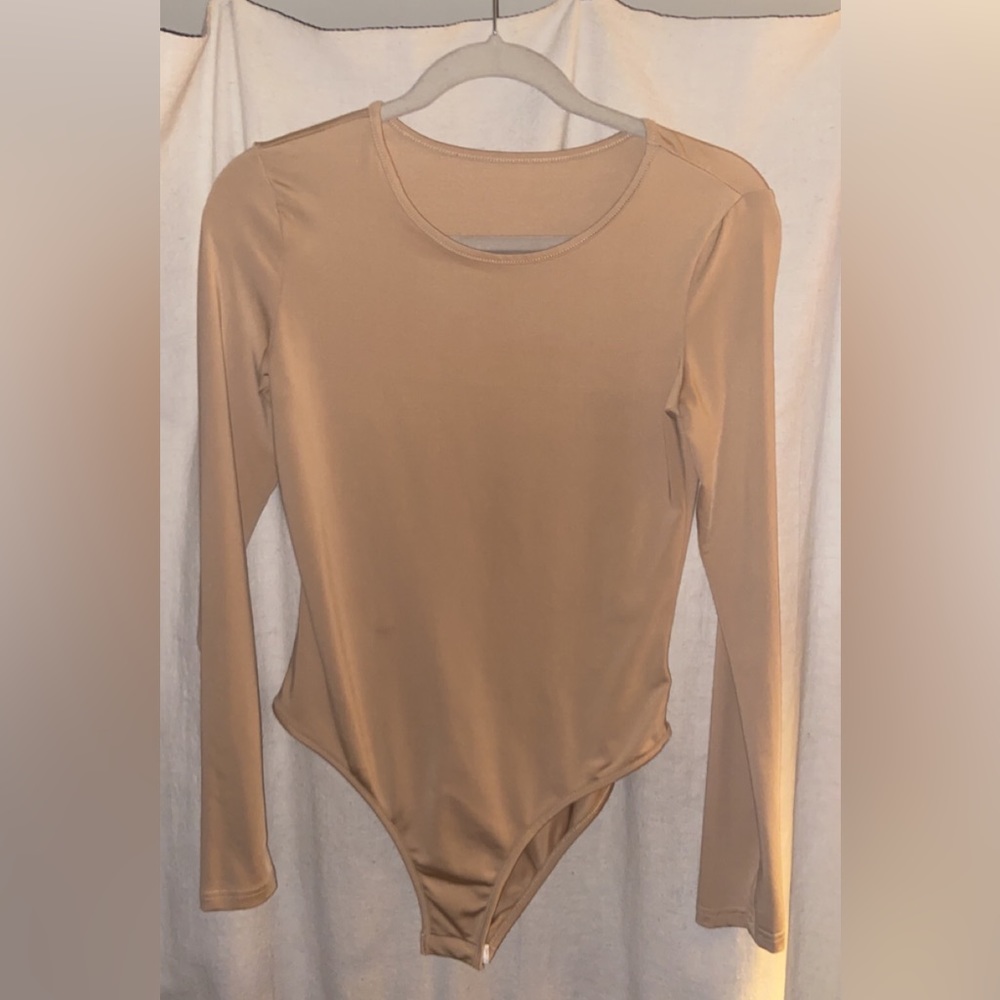 Nude colored body suit